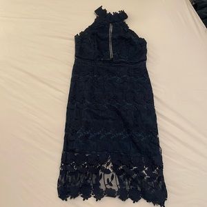 Womens dress beautiful lace details, v cut at bottom on the back. Worn once.
